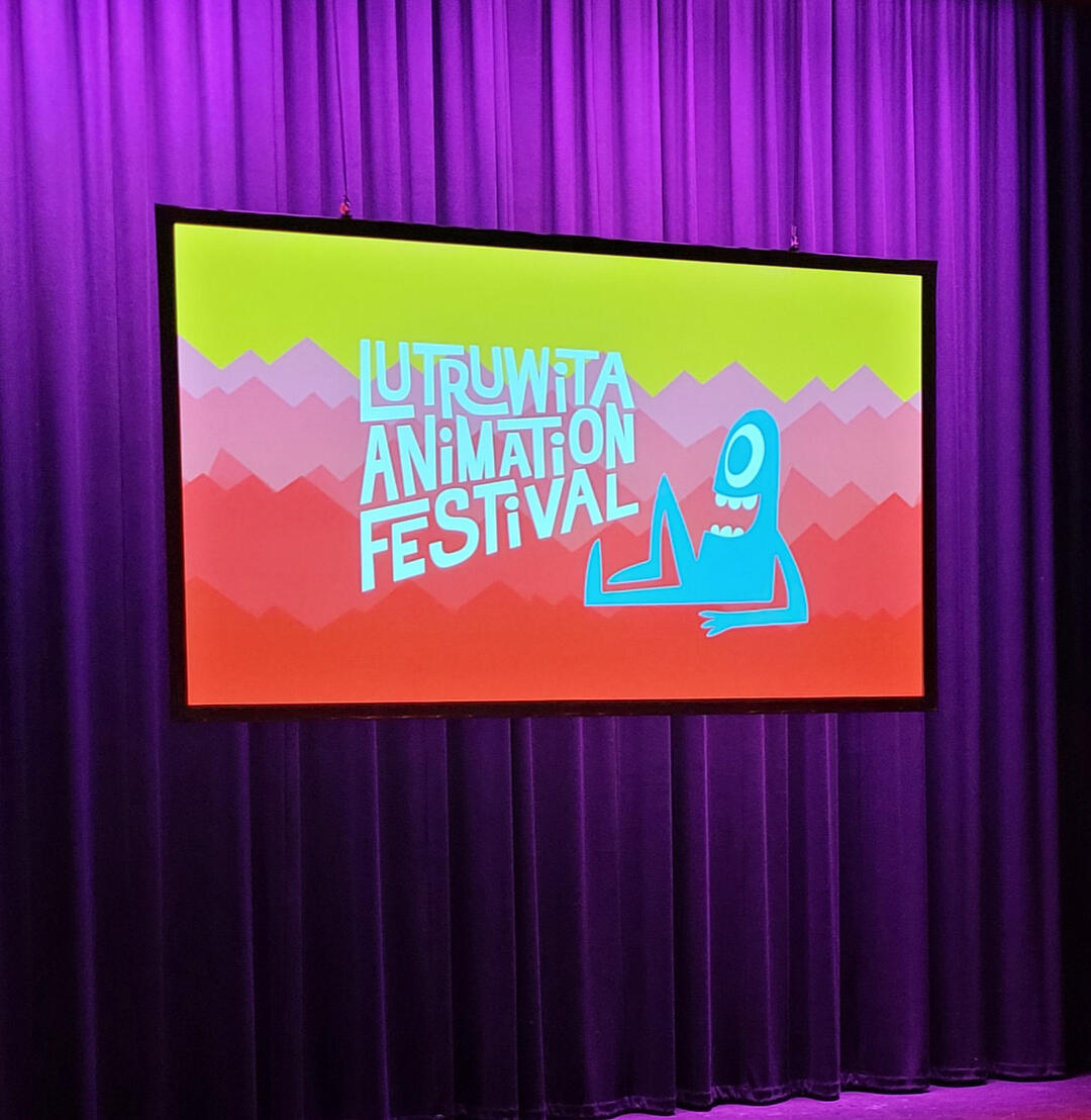 Image of the audience at LUTAF Image of sponsor logos